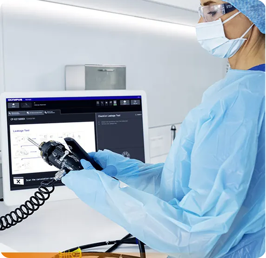 A clinician using Olympus endoscopic hardware during a procedure, guided by an onboard checklist display