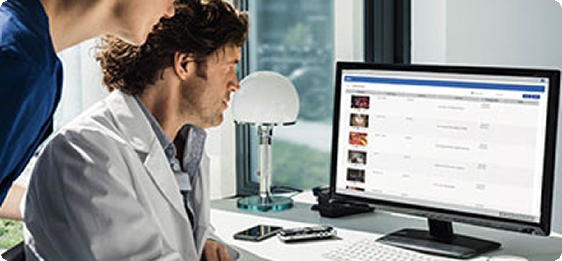 A doctor reviewing procedure recordings in Endobase's dated interface
