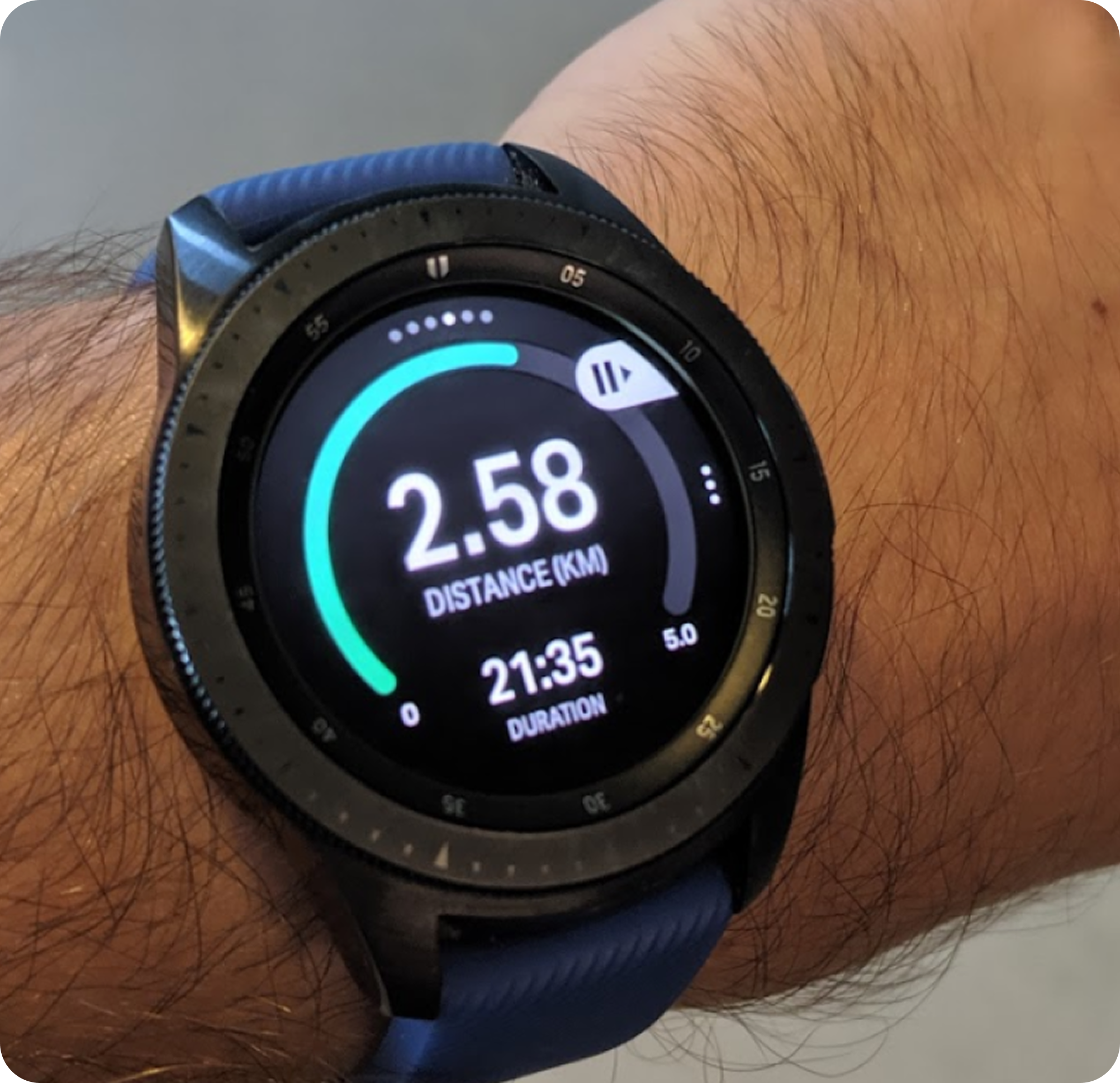 Galaxy Watch worn on-wrist mid-run, showing distance and duration